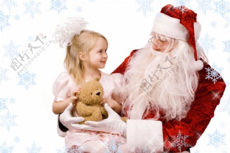 圣诞老人抱着可爱漂亮小女孩图片