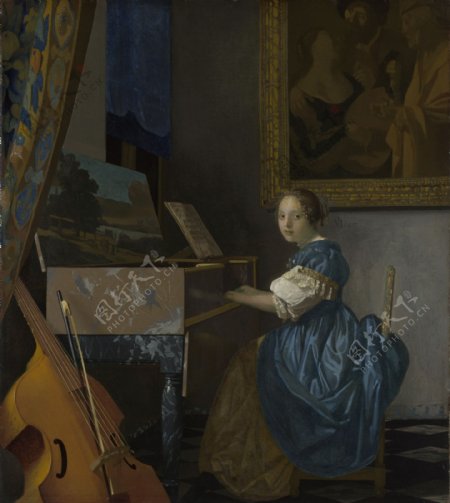 古琴旁的年轻女子图片