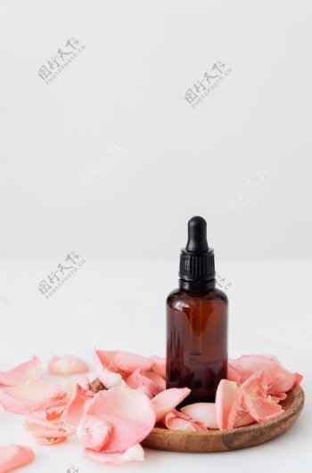 精油花瓣玫瑰玻璃瓶背景素材