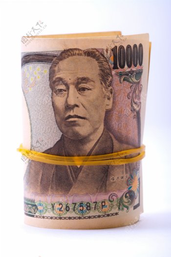 一卷捆着的日元钞票图片
