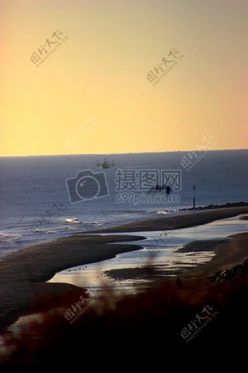 大海日出鸟类钓鱼船