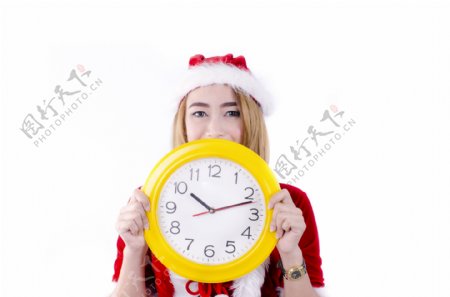 拿着钟表的圣诞美女图片