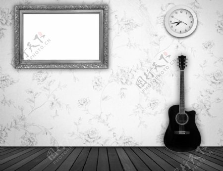 墙壁上的相框与吉他图片